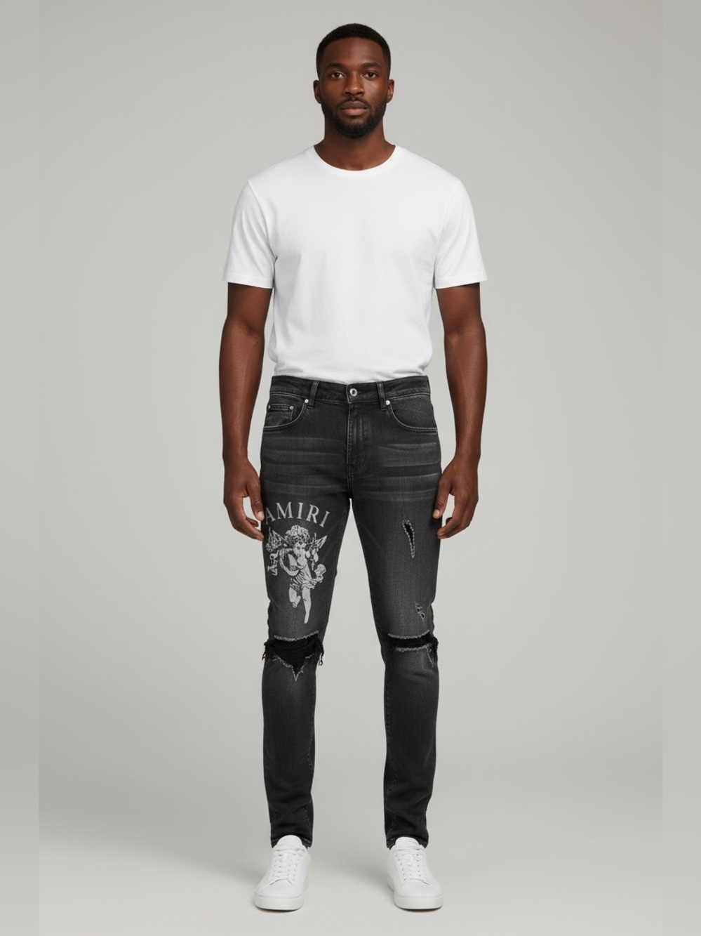 AMIRI Black Distressed Skinny
Stretch Denim Jeans with Cherub Graphic